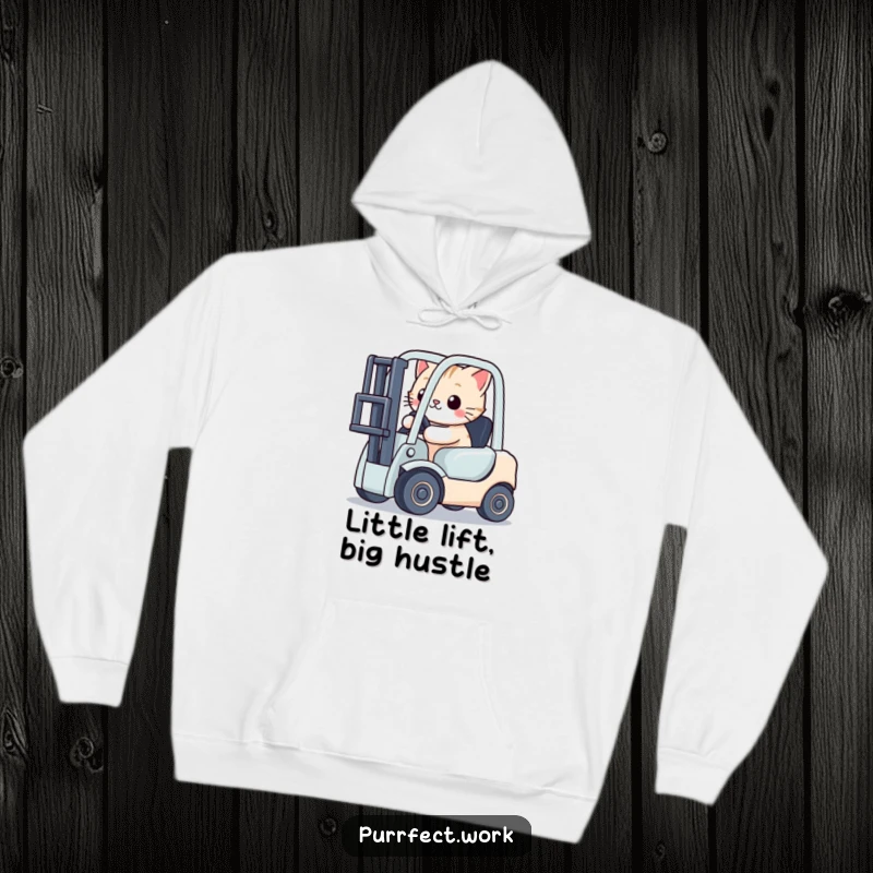 Funny cat focused on driving a miniature toy forklift, depicted on a cozy hoodie, promoting humor and warmth.